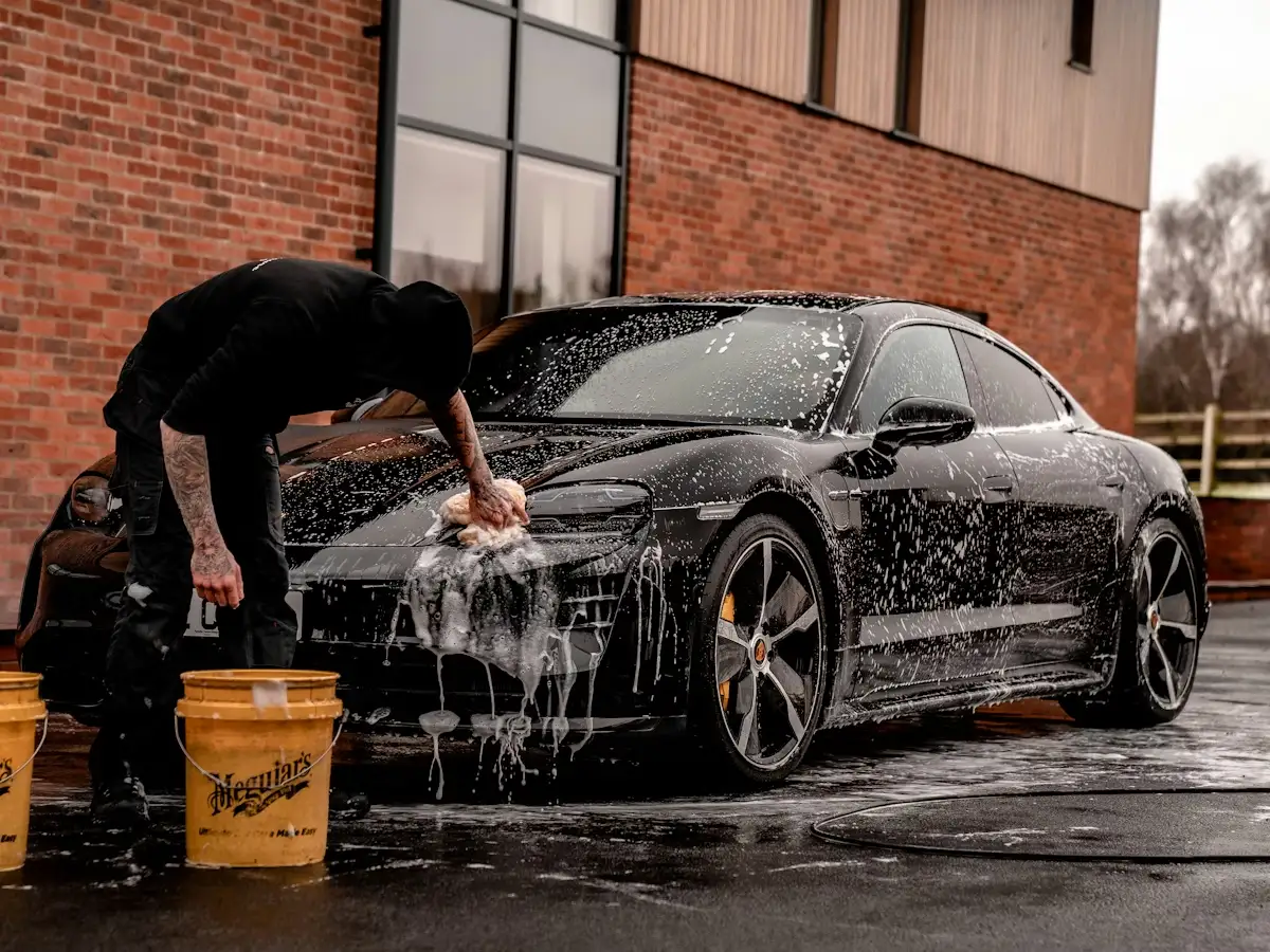 Car detailing professional polishing a vehicle